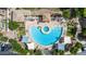 Aerial view showcases a pristine community pool and lounge area with modern sunshades and meticulous landscaping at 2401 E Rio Salado Pkwy # 1192, Tempe, AZ 85288