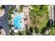Aerial view of a community pool and lawn area complete with shade and plentiful trees at 2401 E Rio Salado Pkwy # 1192, Tempe, AZ 85288