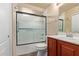 Bathroom featuring a dark vanity with a shower featuring sliding glass doors at 2401 E Rio Salado Pkwy # 1192, Tempe, AZ 85288
