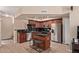 Open kitchen boasts stainless steel appliances, tile countertops, and a kitchen island with barstool seating at 2401 E Rio Salado Pkwy # 1192, Tempe, AZ 85288