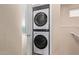 Laundry room with a white stacked washer and dryer unit at 2401 E Rio Salado Pkwy # 1192, Tempe, AZ 85288