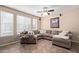 Cozy living room featuring neutral tones, a ceiling fan and a comfortable sectional couch at 2401 E Rio Salado Pkwy # 1192, Tempe, AZ 85288