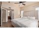 Serene main bedroom suite featuring plush bedding, a ceiling fan and an en-suite bathroom at 2401 E Rio Salado Pkwy # 1192, Tempe, AZ 85288