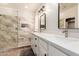 Bright bathroom with double sinks, white cabinetry, and a luxurious walk-in shower at 241 W Roadrunner Dr, Chandler, AZ 85286