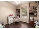Bedroom with neutral paint, window, display shelves, and carpeted floor at 241 W Roadrunner Dr, Chandler, AZ 85286