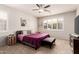 Comfortable bedroom with a ceiling fan, natural light, and calming decor at 241 W Roadrunner Dr, Chandler, AZ 85286