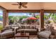 Serene covered patio with outdoor seating overlooking the pool, offering a tranquil retreat at 241 W Roadrunner Dr, Chandler, AZ 85286
