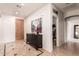Elegant entryway featuring tile floors, decorative console table, and access to other rooms at 241 W Roadrunner Dr, Chandler, AZ 85286