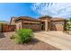 A home with desert landscaping, three car garage, and a stone accent entry at 241 W Roadrunner Dr, Chandler, AZ 85286