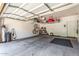Spacious garage with storage racks, bike rack and water filtration system at 241 W Roadrunner Dr, Chandler, AZ 85286