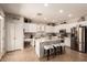 Bright, open kitchen with a center island, stainless steel appliances, and lots of cabinet space at 241 W Roadrunner Dr, Chandler, AZ 85286