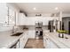 This spacious kitchen offers white cabinets, stainless steel appliances, and ample counter space at 241 W Roadrunner Dr, Chandler, AZ 85286