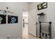 A bright laundry room with decor, leading to other parts of the house at 241 W Roadrunner Dr, Chandler, AZ 85286