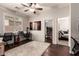 Bright home office with hardwood floors, ceiling fan and an adjacent bedroom at 241 W Roadrunner Dr, Chandler, AZ 85286