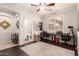 Bright home office with hardwood floors, ceiling fan and an adjacent bathroom at 241 W Roadrunner Dr, Chandler, AZ 85286