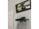 Indoor security system display in a neutral-painted wall, showing security cameras at 241 W Roadrunner Dr, Chandler, AZ 85286