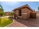 This property features a well maintained yard and desert landscaping along the side of the home at 241 W Roadrunner Dr, Chandler, AZ 85286