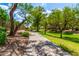 Scenic community walkway lined with lush greenery and trees, offering a peaceful environment at 241 W Roadrunner Dr, Chandler, AZ 85286