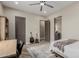 Bedroom with a desk, guitars, ceiling fan, and ensuite bathroom at 2516 W Joy Ranch Rd, Phoenix, AZ 85086