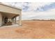 Inviting covered patio with plenty of space for outdoor furniture overlooking the backyard at 2516 W Joy Ranch Rd, Phoenix, AZ 85086