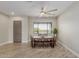 Dining area with bench seating, ceiling fan, and large window offering natural light at 2516 W Joy Ranch Rd, Phoenix, AZ 85086