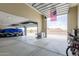 Large garage with high ceilings, overhead doors, and views of the desert landscape at 2516 W Joy Ranch Rd, Phoenix, AZ 85086