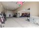 Massive garage space offering ample storage, shelving, and room for multiple vehicles at 2516 W Joy Ranch Rd, Phoenix, AZ 85086