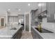 Well appointed kitchen featuring an island, granite countertops, stainless steel appliances, and gray cabinetry at 2516 W Joy Ranch Rd, Phoenix, AZ 85086