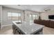 Kitchen island featuring granite countertops and stainless steel sink at 2516 W Joy Ranch Rd, Phoenix, AZ 85086