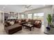Open concept living room with kitchen featuring island seating and access to patio at 2516 W Joy Ranch Rd, Phoenix, AZ 85086