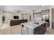 Open floorplan showcasing living room and kitchen featuring an island with seating at 2516 W Joy Ranch Rd, Phoenix, AZ 85086