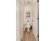 Efficient half bathroom with a toilet, cabinet, and wooden-look flooring at 2631 S Sulley Dr # 106, Gilbert, AZ 85295