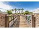 Scenic community bridge with palm trees, landscaping, and water features at 2631 S Sulley Dr # 106, Gilbert, AZ 85295