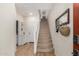 Inviting entryway with staircase, decor, and doorway leading to a bathroom area at 2631 S Sulley Dr # 106, Gilbert, AZ 85295