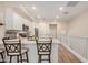 Bright kitchen showcasing white cabinetry, a center island, and modern design elements at 2631 S Sulley Dr # 106, Gilbert, AZ 85295