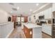 Open concept kitchen featuring modern appliances, a large island, and abundant natural light at 2631 S Sulley Dr # 106, Gilbert, AZ 85295