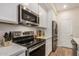 Contemporary kitchen featuring stainless steel appliances, ample counter space, and sleek cabinetry at 2631 S Sulley Dr # 106, Gilbert, AZ 85295