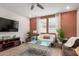 Inviting living room with stylish furnishings, a ceiling fan, and ample space for relaxation at 2631 S Sulley Dr # 106, Gilbert, AZ 85295
