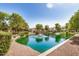 Scenic view of a pond with a fountain and bridge, enhancing the community's natural beauty at 2631 S Sulley Dr # 106, Gilbert, AZ 85295