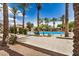 Community pool surrounded by palm trees, offering a refreshing oasis for residents at 2631 S Sulley Dr # 106, Gilbert, AZ 85295