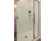 Newly tiled shower features recessed shelving for toiletries, and glass door at 2631 S Sulley Dr # 106, Gilbert, AZ 85295