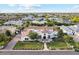 Stunning aerial view of a white home with a terracotta tile roof and lush landscaping at 2748 E Warbler Rd, Gilbert, AZ 85297