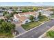 Expansive aerial view of a white home featuring a terracotta tile roof and well-manicured grounds at 2748 E Warbler Rd, Gilbert, AZ 85297