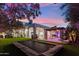Expansive backyard with a pool, lounge areas, and a trampoline, perfect for outdoor entertainment at 2748 E Warbler Rd, Gilbert, AZ 85297