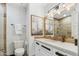 Bathroom with modern lighting, marble countertops, and custom mirror at 2748 E Warbler Rd, Gilbert, AZ 85297