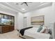 Calm bedroom with a plush bed, soft lighting, and window with shutters for a tranquil retreat at 2748 E Warbler Rd, Gilbert, AZ 85297