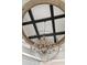 Close up on a contemporary chandelier, featuring a geometric design and crystal accents at 2748 E Warbler Rd, Gilbert, AZ 85297