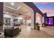 Expansive covered patio with outdoor bar, dining, and lounge areas with a serene view at 2748 E Warbler Rd, Gilbert, AZ 85297