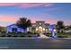 Striking property with custom outdoor lighting highlighting architectural details at 2748 E Warbler Rd, Gilbert, AZ 85297