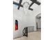 Grand foyer with high ceilings, hardwood floors, curved wrought iron staircase, and designer chandelier at 2748 E Warbler Rd, Gilbert, AZ 85297